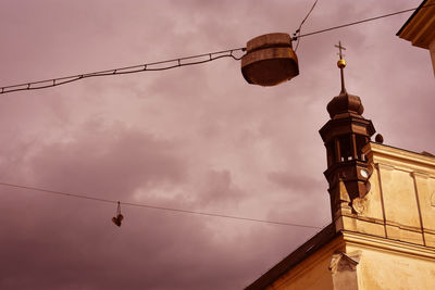 Low angle view of street light against building