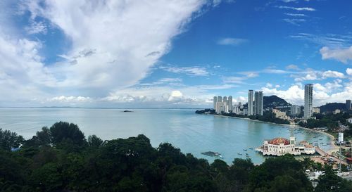 High angle view of city against cloudy sky