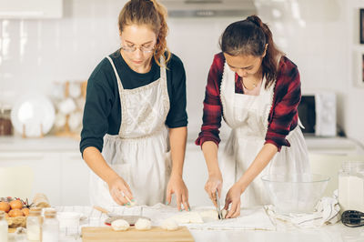 Women standing on table