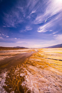 Scenic view of desert against dramatic sky