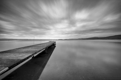 Pier over sea against sky