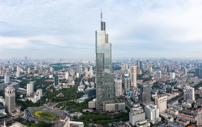 High angle view of modern buildings in city against sky