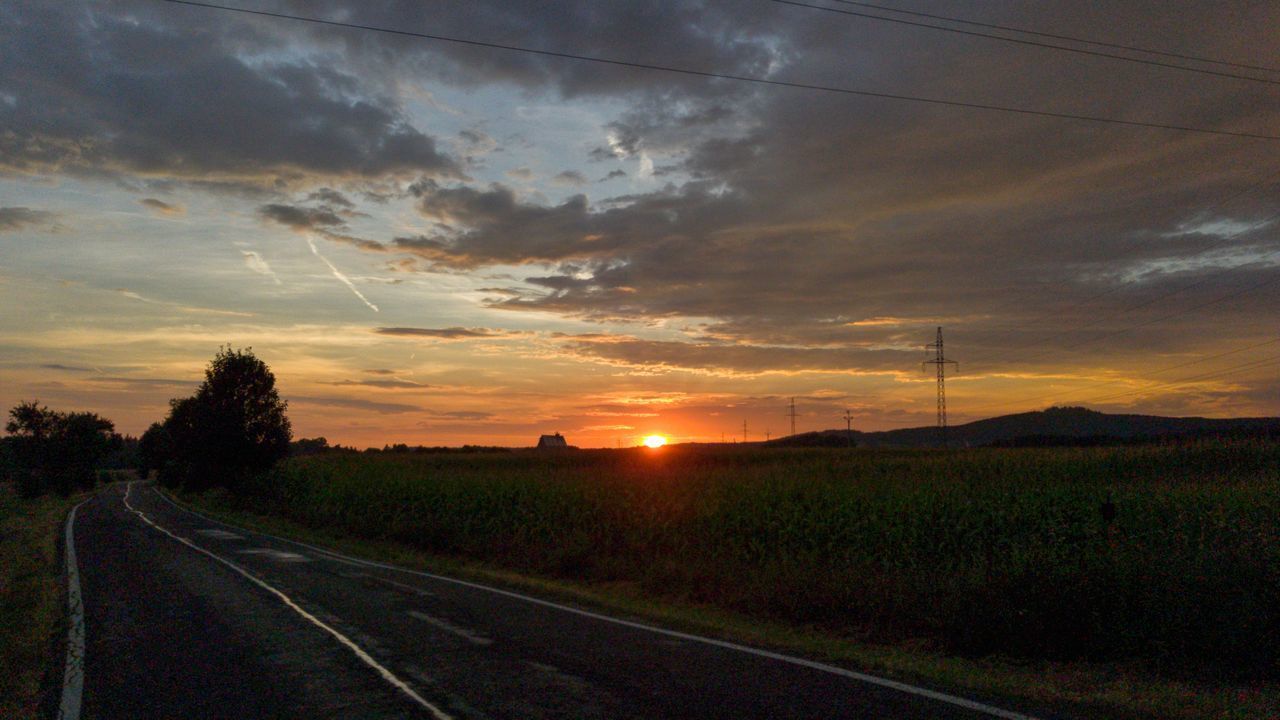 SCENIC VIEW OF ROAD AGAINST SKY DURING SUNSET