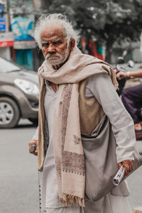 Portrait of man standing on street