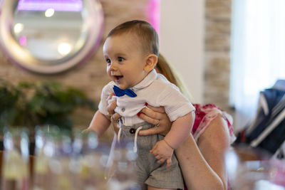Side view of boy playing with toys