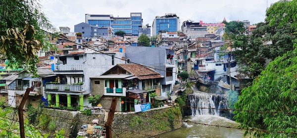 High angle view of river amidst buildings in town