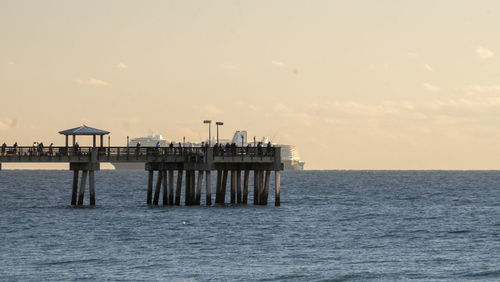 Pier over sea against sky