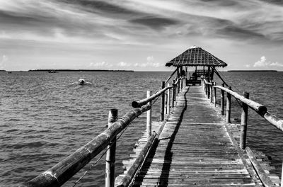 Pier over sea against sky