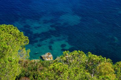 High angle view of sea against blue sky