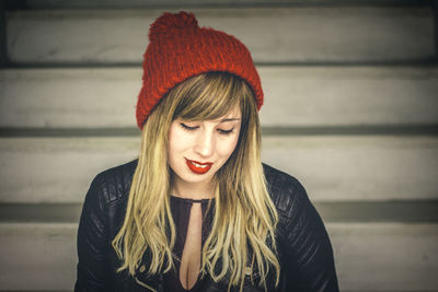 Close-up of thoughtful young woman sitting on steps