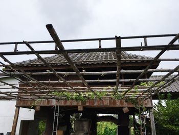 Low angle view of metallic structure against sky