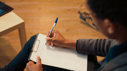 Midsection of man working at office