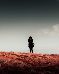 Full length of man standing on rock