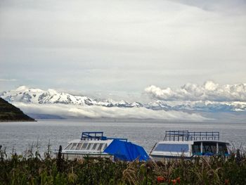 Scenic view of sea against cloudy sky