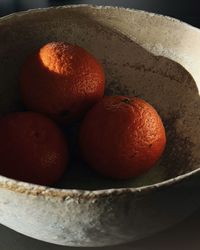 Close-up of oranges in plate