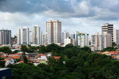 Buildings in city against sky