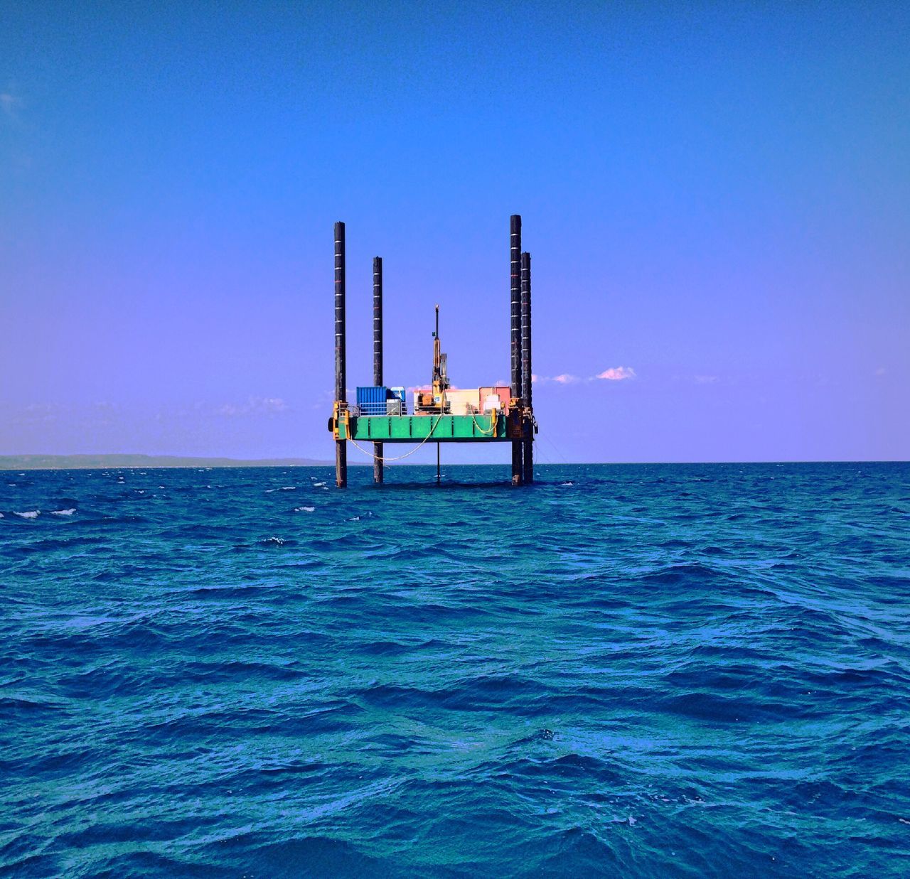 sea, water, horizon over water, clear sky, blue, copy space, tranquil scene, tranquility, scenics, waterfront, nature, beauty in nature, sky, pier, idyllic, rippled, transportation, ocean, lighthouse, outdoors