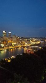 High angle view of illuminated buildings in city at night