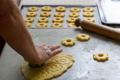 Cropped hands of person preparing food