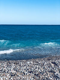 Scenic view of sea against clear sky