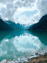 Panoramic view of lake and mountains against sky