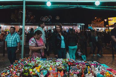 Group of people at market stall