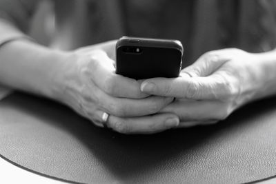 Close-up of man using mobile phone