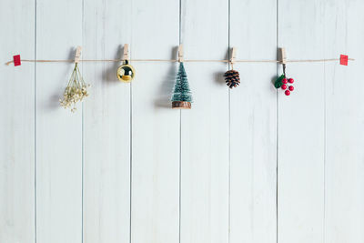 Low angle view of decorations hanging on wall