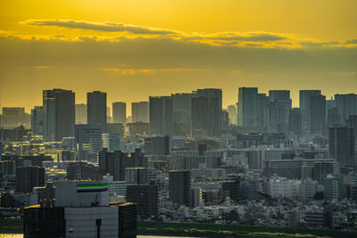 Cityscape against sky during sunset