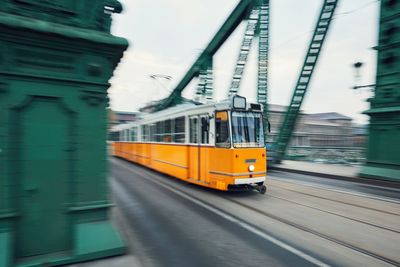 Train on railroad tracks in city