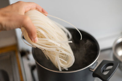 Cropped hand of woman holding food