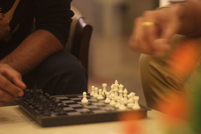 People playing chess at home