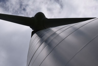 Low angle view of windmill against sky