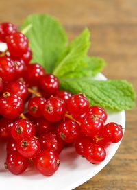 Close-up of red currants on table