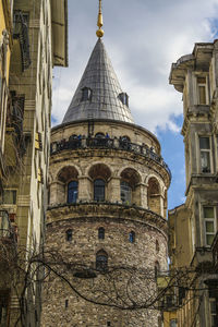 Galata tower amidst buildings against sky