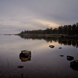 Scenic view of lake against sky during sunset