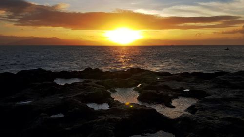 Scenic view of sea during sunset