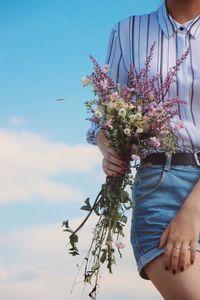 Close-up of woman holding flowers