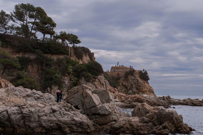 Tourists on rock formation