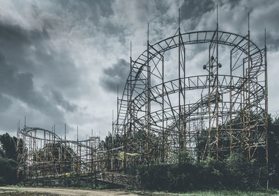 Low angle view of ferris wheel against sky