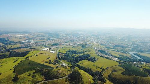 Aerial view of agricultural landscape against clear sky