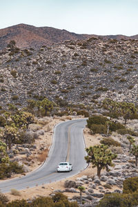 High angle view of car on road leading towards mountains