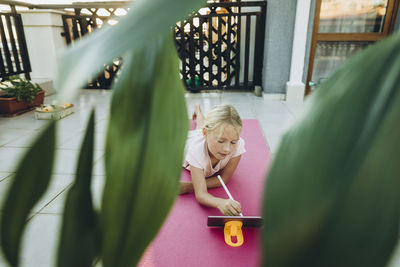 Girl drawing on a tablet with digitized pen