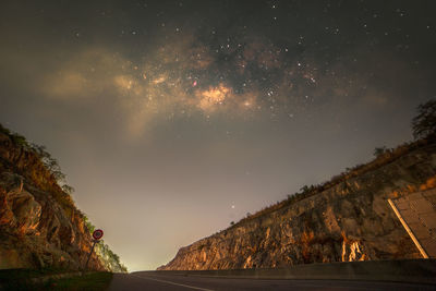 Low angle view of trees against sky at night