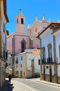 Low angle view of buildings against blue sky