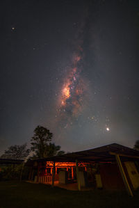 Low angle view of building against sky at night