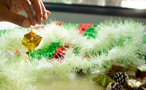 Close-up of hand holding christmas decoration