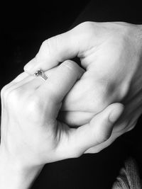 Cropped image of couple with holding hands