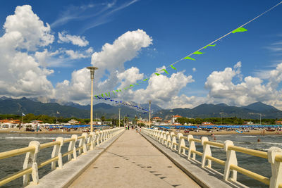 Scenic view of sea and mountains against sky