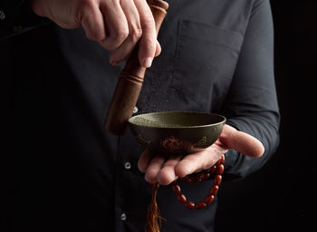 Midsection of woman holding ice cream